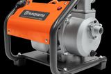 Front view of a Husqvarna water pump with visible control panel and hose connection.