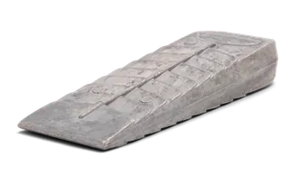 Side view of a metallic wedge used in construction or forestry.