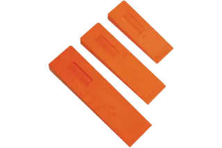Top view of three Husqvarna felling wedges of different sizes.