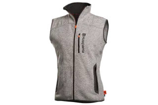 Vue de face d’un gilet sans manches Husqvarna avec poches zippées.