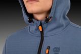 Close-up of a person wearing a hooded sweatshirt with a zipper and drawstrings.