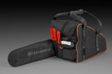 Front view of a Husqvarna chainsaw carrying case with multiple compartments.