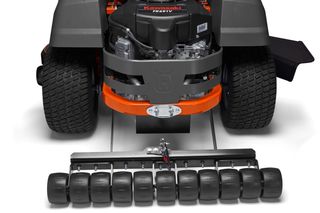 Rear view of a ride-on mower with a roller attachment for lawn care.