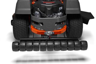 Rear view of a lawn mower with a roller attachment for creating lawn stripes.