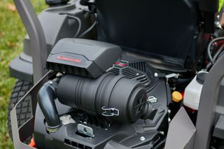 Close-up view of a Husqvarna ride-on mower engine compartment.
