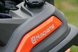 Close-up of a Husqvarna product showing the brand logo and part of a tire.