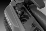 Close-up view of a Husqvarna ride-on mower's control panel and cup holder.