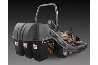 Rear view of a ride-on mower with attached grass collection system.