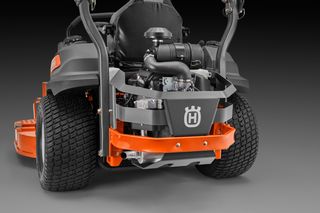 Rear view of a Husqvarna commercial front mower with visible engine components.