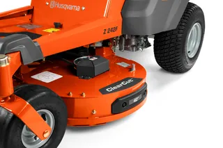 Close-up view of a Husqvarna Z 242F ride-on mower's cutting deck.