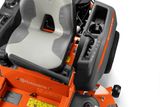 Close-up view of a Husqvarna ride-on mower's seat and control panel.