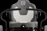 Front view of a Husqvarna ride-on mower seat with steering controls.