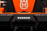 Front view of a Husqvarna commercial front mower with a visible logo.