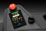 Close-up of a Husqvarna product control panel with illuminated buttons.