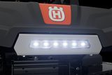 Close-up of a Husqvarna product featuring LED lights and a prominent logo.