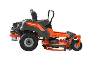 Side view of a Husqvarna zero-turn mower with cutting deck.