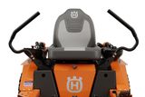 Front view of a Husqvarna ride-on mower seat with steering handles.