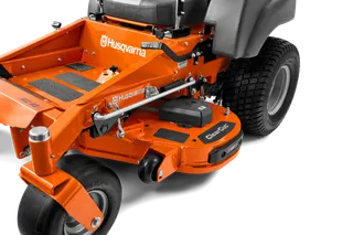 Close-up view of a Husqvarna commercial front mower with cutting deck.