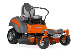 Side view of a Husqvarna zero-turn ride-on mower with visible cutting deck.