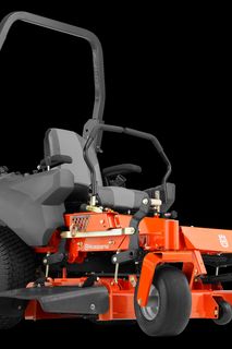 Side view of a Husqvarna commercial front mower with cutting deck.