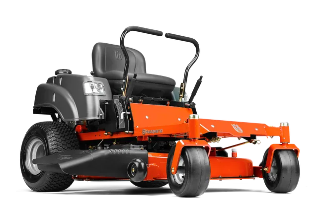 Vue latérale d’une tondeuse autoportée Husqvarna avec plateau de coupe.