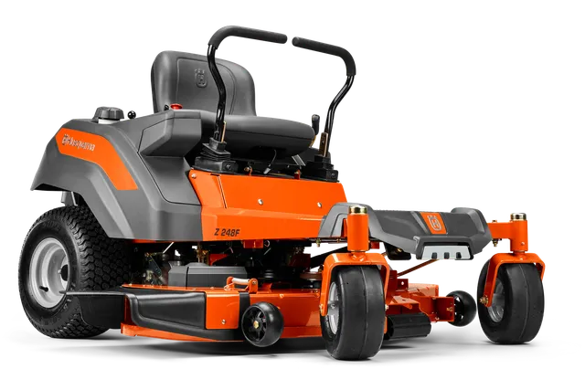 Side view of a Husqvarna zero-turn ride-on mower showcasing its cutting deck and ergonomic design.