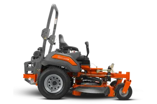 Side view of a Husqvarna zero-turn ride-on mower with visible cutting deck.
