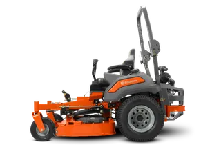 Side view of a Husqvarna zero-turn mower with cutting deck.