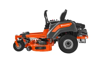 Side view of a Husqvarna zero-turn ride-on mower.