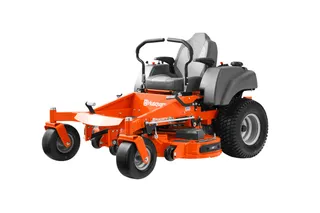 Side view of a Husqvarna zero-turn ride-on mower with visible cutting deck.