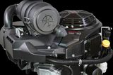 Side view of a compact engine with visible air filter and cooling fan.