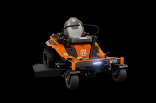 Front view of a Husqvarna zero-turn mower with visible seat and steering controls.