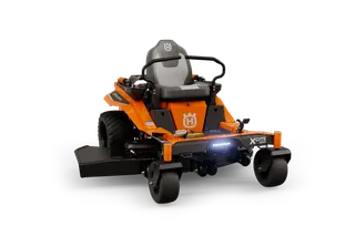 Front view of a Husqvarna zero-turn mower with visible seat and steering controls.
