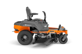 Side view of a ride-on lawn mower with visible cutting deck.
