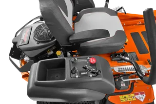 Close-up view of the control panel and seat of a Husqvarna ride-on mower.