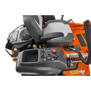 Close-up view of the control panel and seat of a Husqvarna ride-on mower.