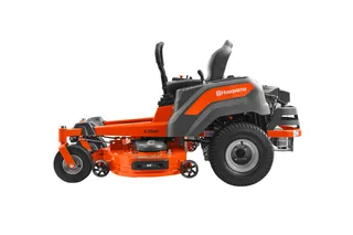 Side view of a Husqvarna zero-turn ride-on mower with cutting deck.