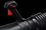 Close-up view of a black and red control handle on a cylindrical product.