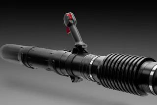 Side view of a construction tool with a handle and nozzle.