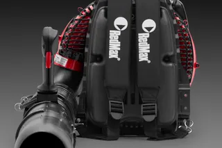 Front view of a RedMax backpack leaf blower with ergonomic straps and nozzle.