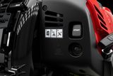 Close-up view of a product with a start button and instructional icons on its panel.