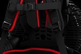 Close-up of a backpack harness with straps and ventilation details.