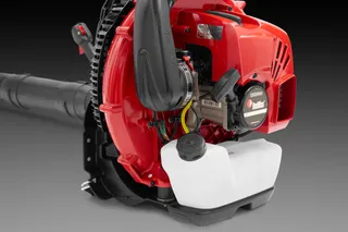 Side view of a backpack leaf blower showcasing its engine and fuel tank.