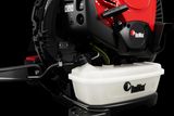 Close-up view of a RedMax product with visible fuel tank and engine components.