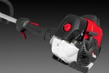 Side view of a RedMax brush cutter engine with ergonomic handle.