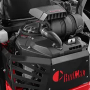 Front view of a RedMax engine with air filter and exhaust components.